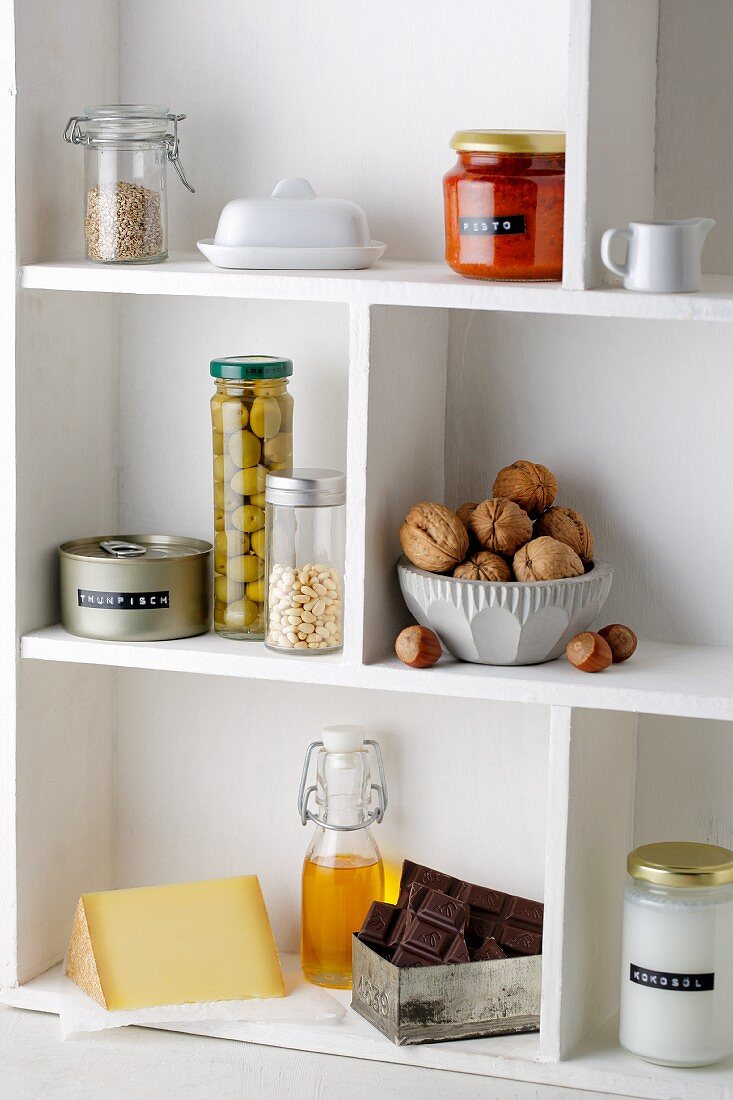 Food items on kitchen shelves