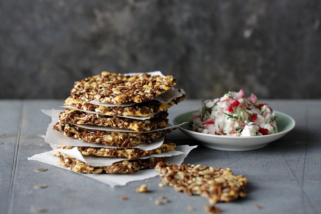 Linseed and cheese crackers with radish cream cheese