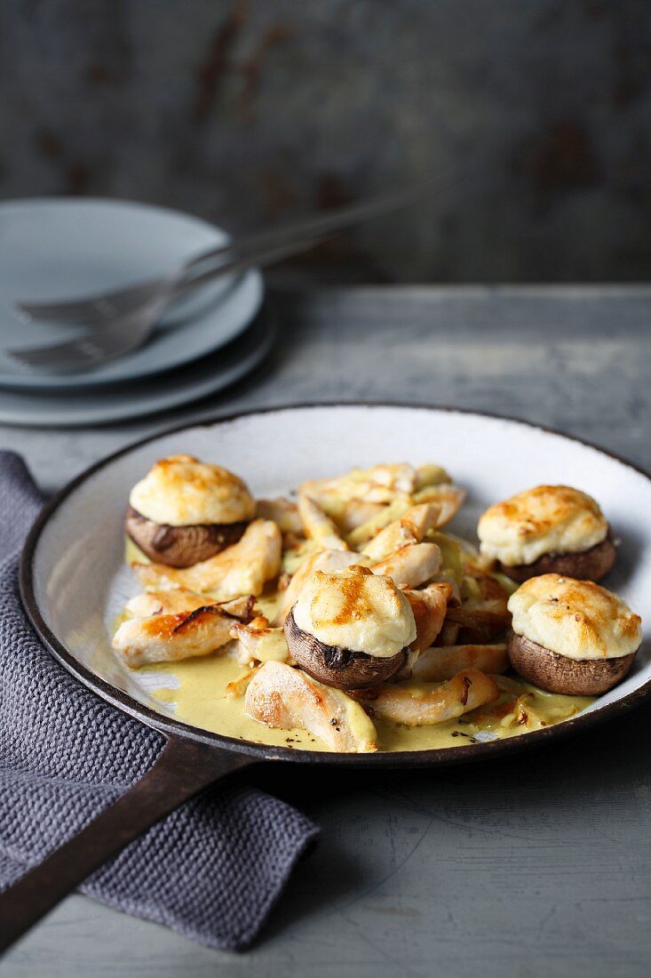 Chicken strips in creamy curry sauce with stuffed cauliflower mushrooms