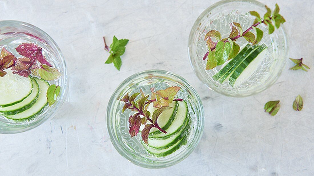 Infused water with cucumber and herbs