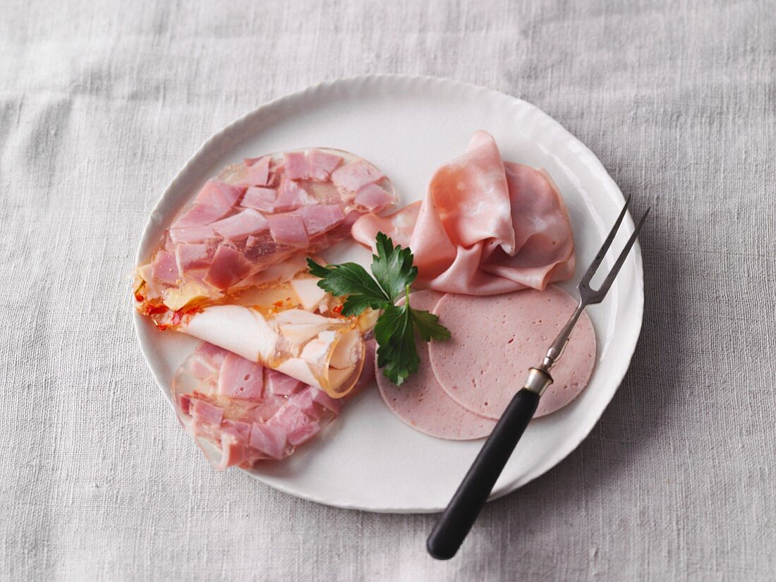 Cold cuts: mortadella, sliced aspic and sliced Bierschinken (ham sausage)