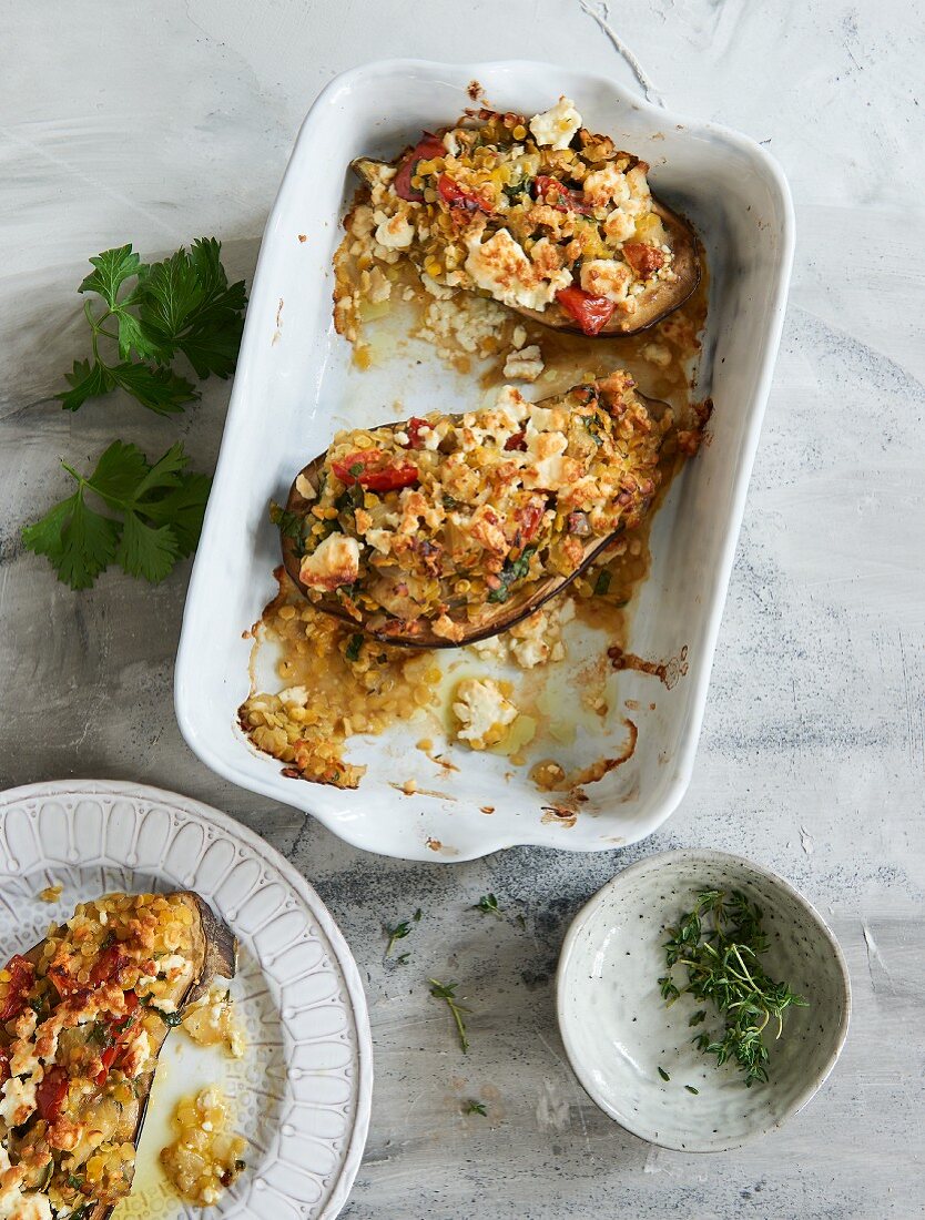 Oven-baked aubergines stuffed with lentils and feta