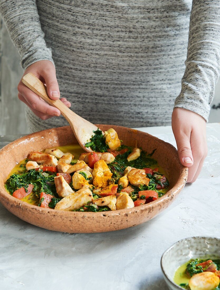 Chicken and vegetable curry with spinach and coconut milk