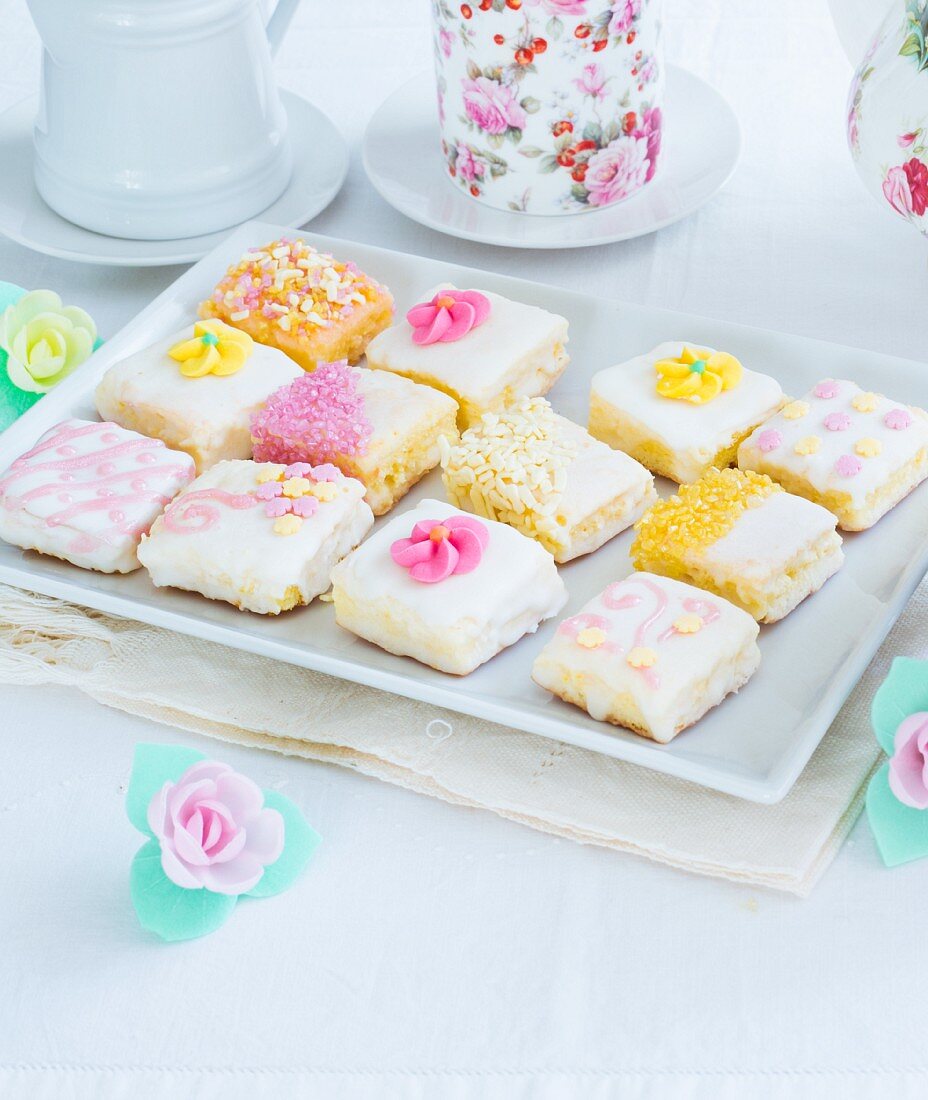 Homemade mini cakes decorated with sugar flowers