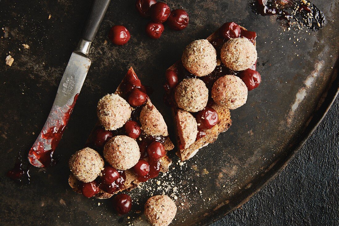 Rye bread with liver sausage balls and sour cherries