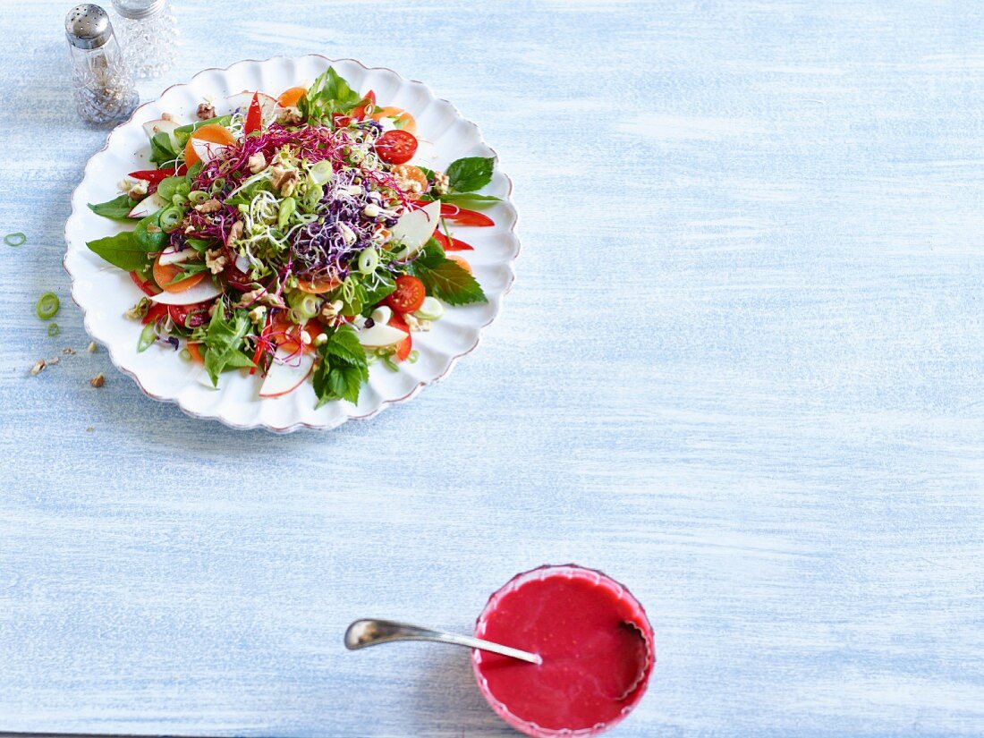 Wild herb salad with apple and shoots