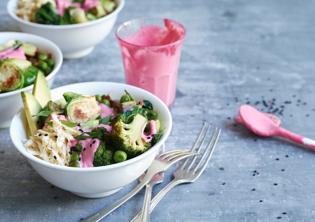 Green veggie bowls with brussels sprouts, broccoli and beetroot sauce