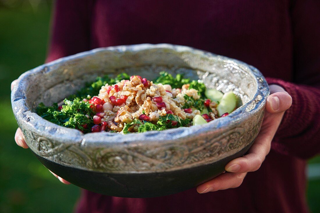 Superfood salad with kale, quinoa and pomegranate seeds