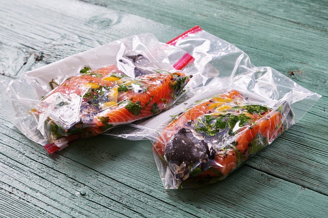 Salmon in plastic bags from the sous-vide