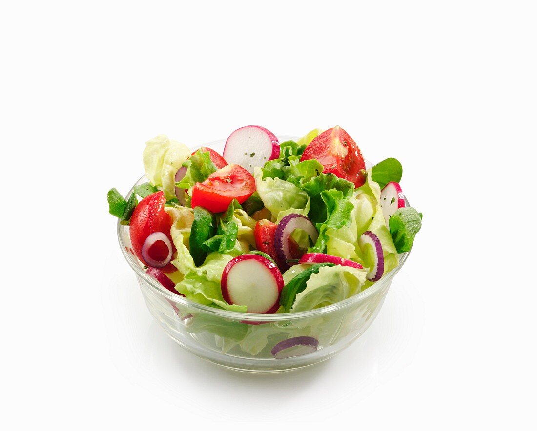 A mixed salad with garden lettuce, lamb's lettuce, tomatoes and radishes