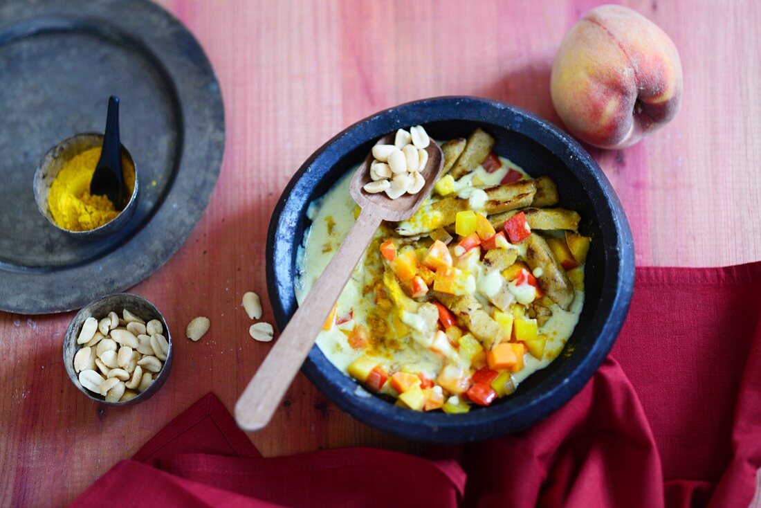 Lupine and peanut curry with fresh peaches
