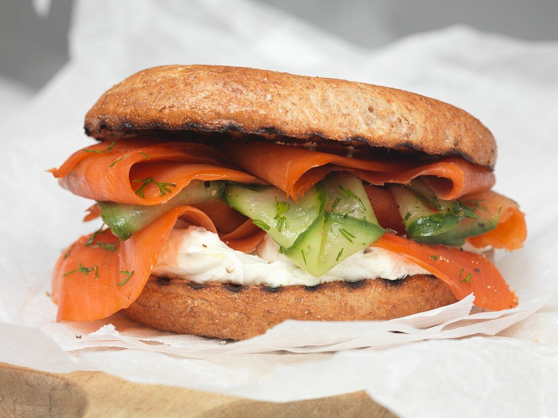 A smoked salmon bagel with cucumber