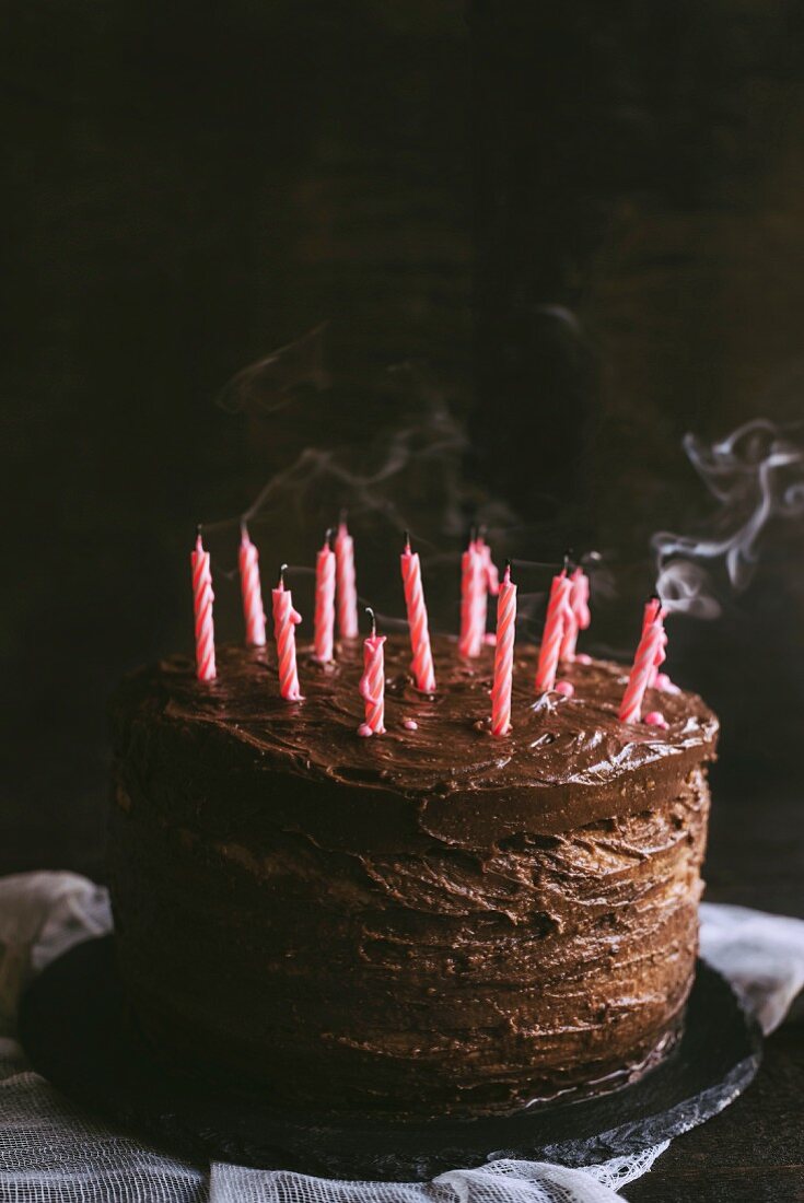 Blowed candles on chocolate cakes