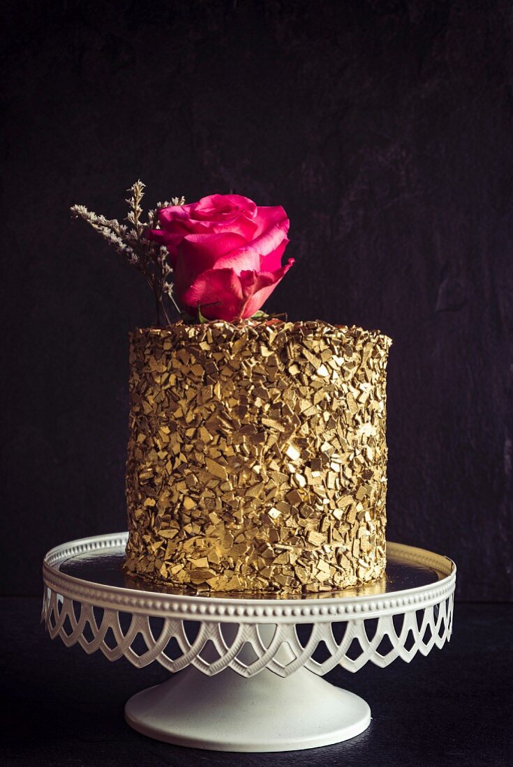 Golden chocolate cake on dark background