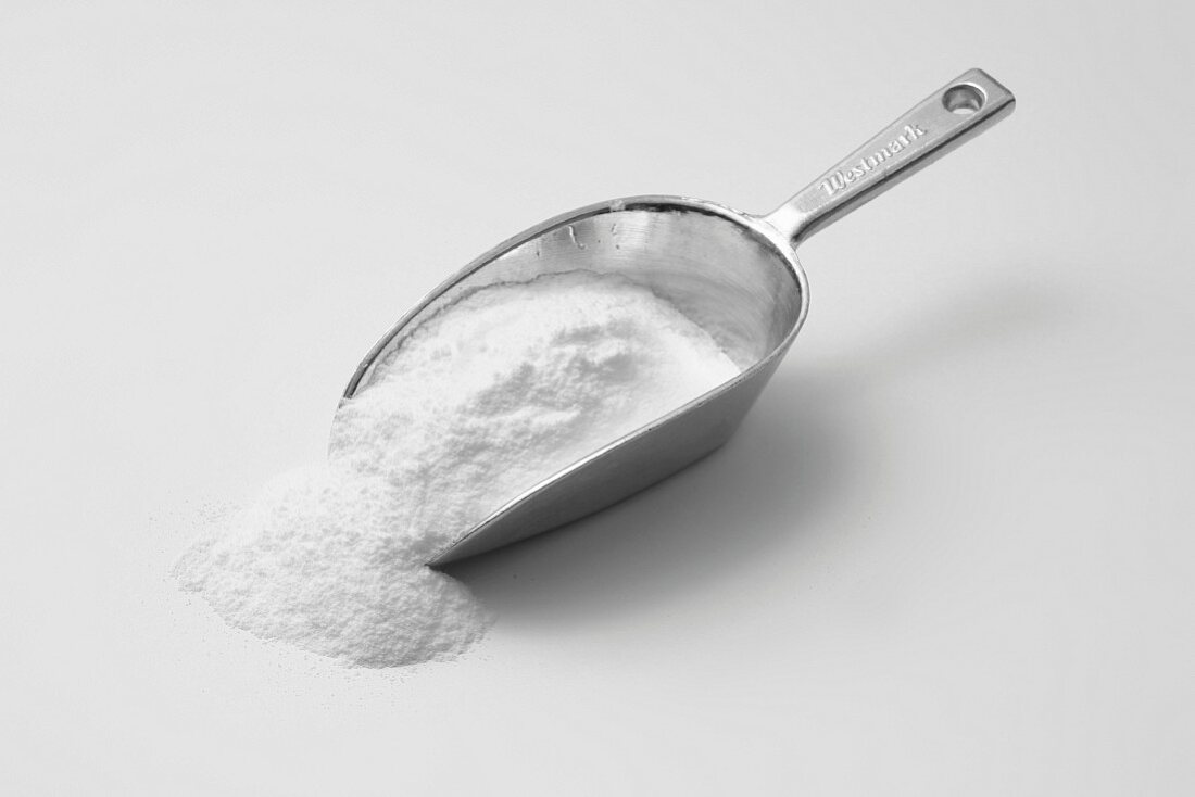 Milk powder on a metal scoop