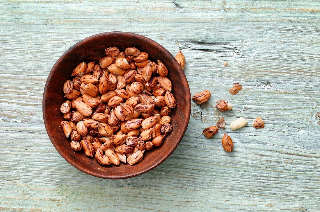 Wild peanuts in a wooden bowl