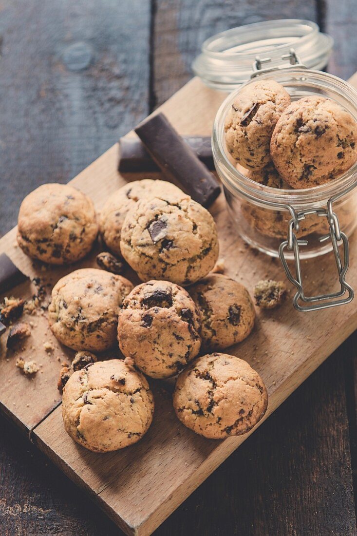 Mini homemade chocolate chip cookies on wooden background, selective focus