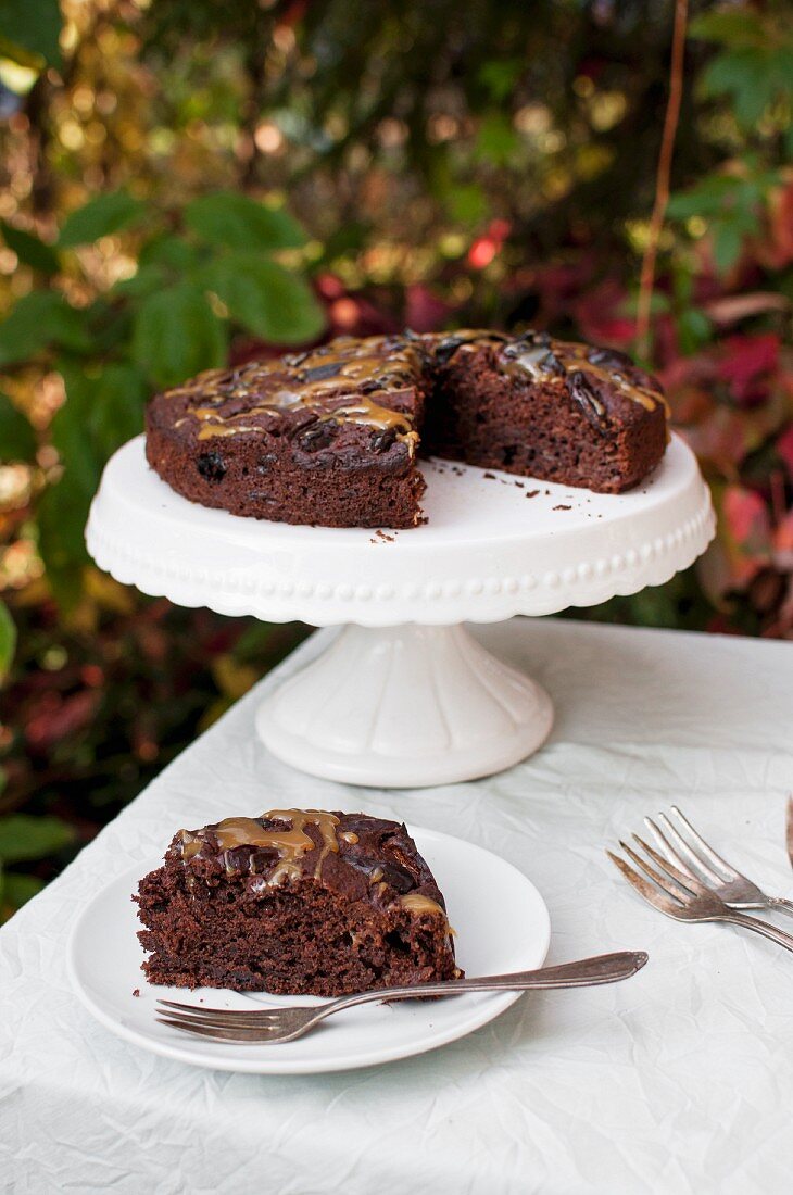 Banana and chocolate cake with dried dates and caramel glaze