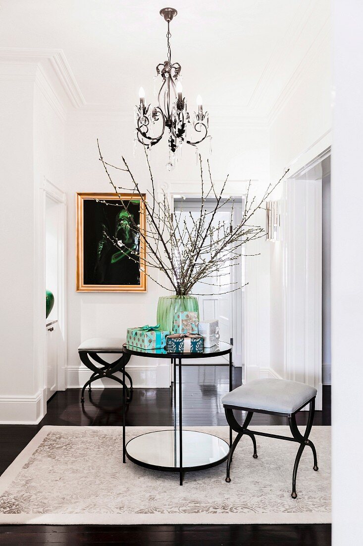 Elegant hallway in black and white with a round table