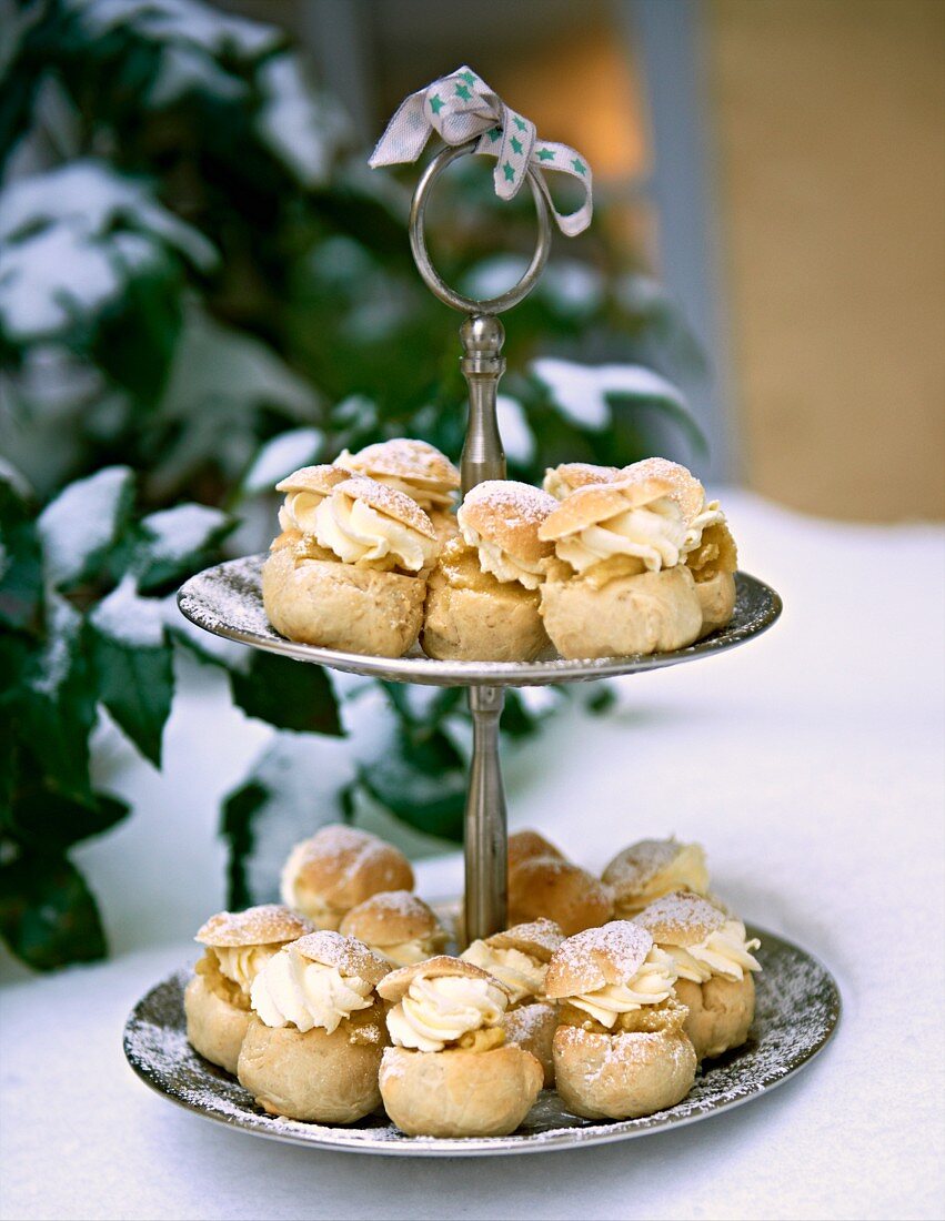 Small profiteroles on a cake stand