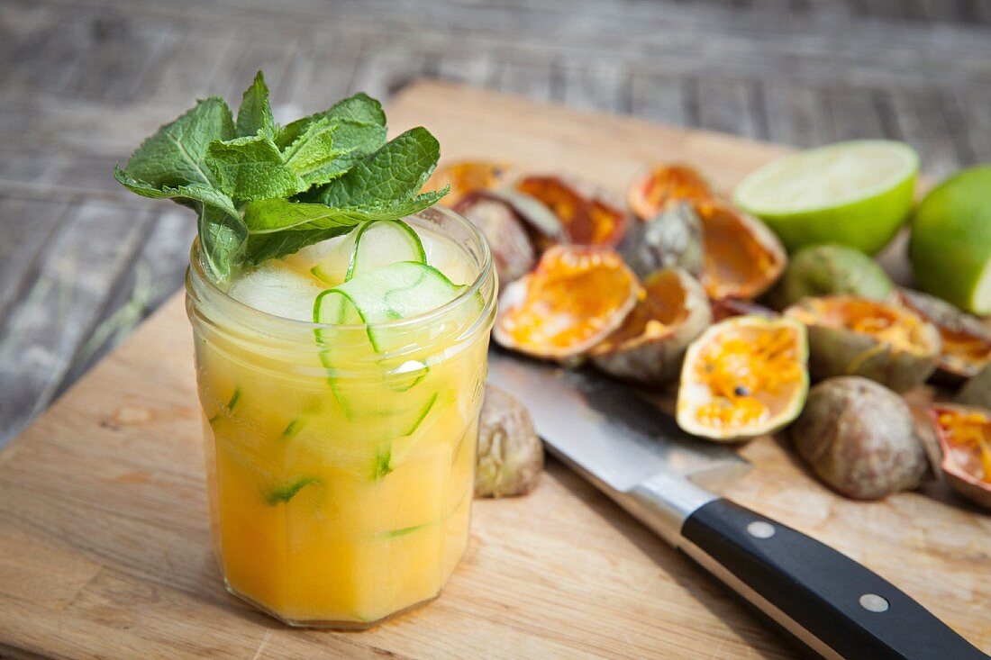 A passion fruit cocktail with mint and cucumber