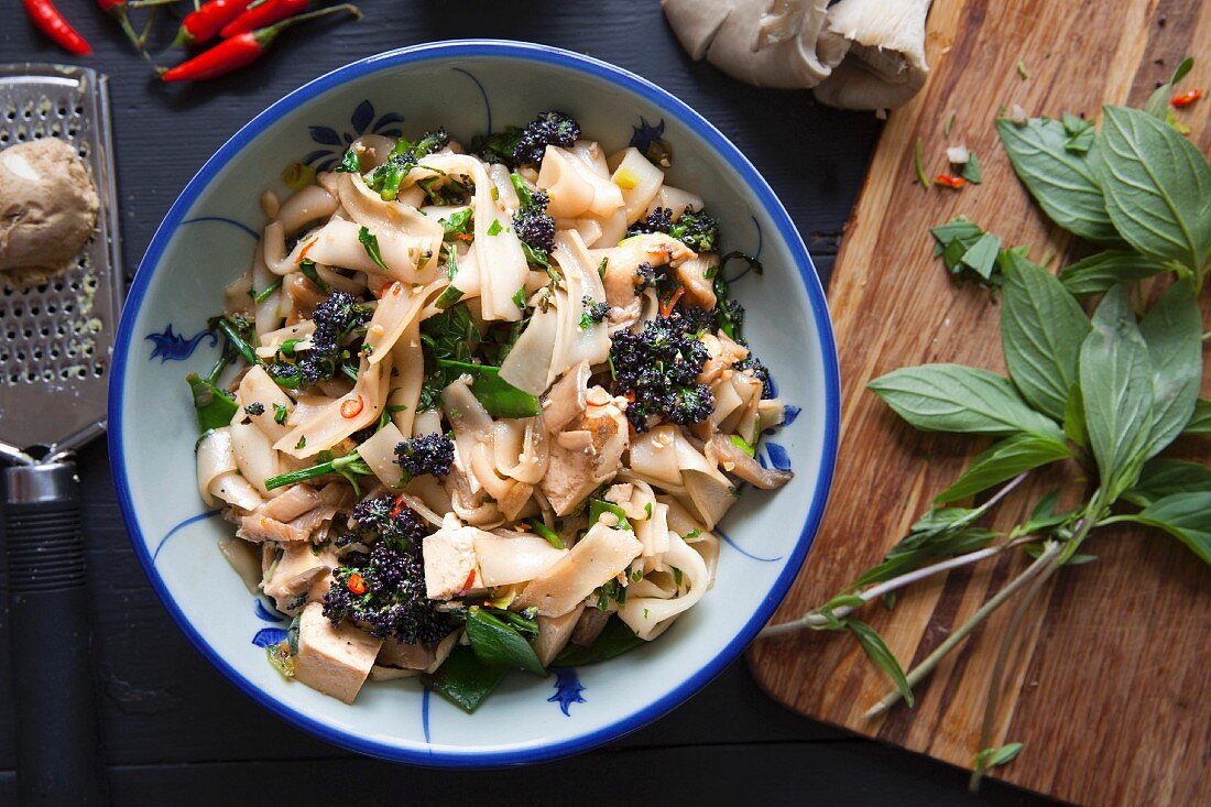 Stir fry with tofu, purple brocoli, thai basil, chilli and oyster mushrooms