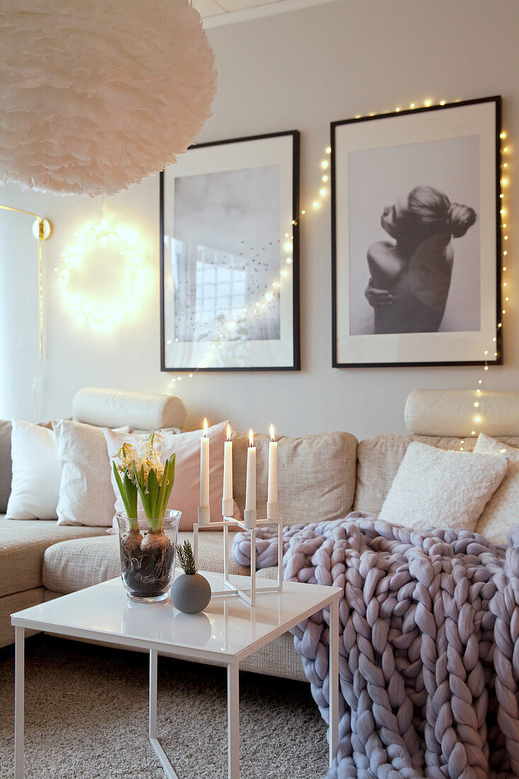 Cosily lit living room with wintry accessories