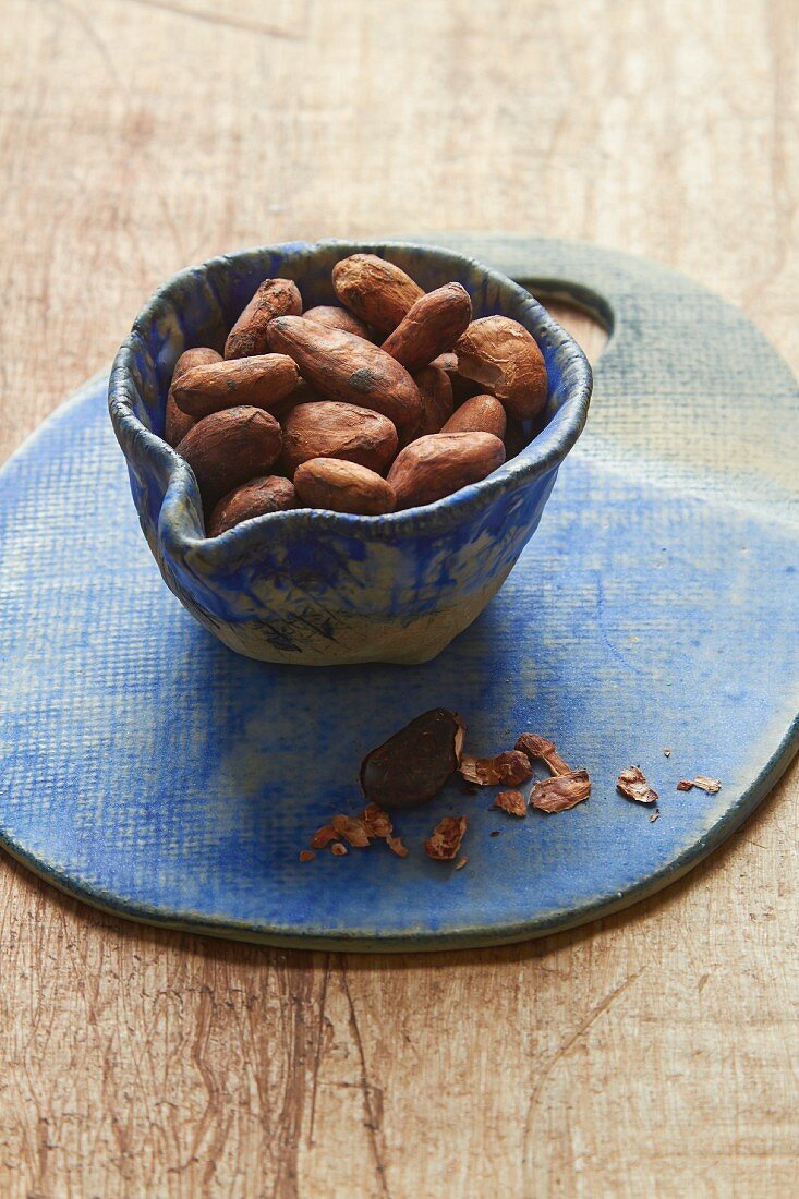 Cocoa beans in a ceramic bowl