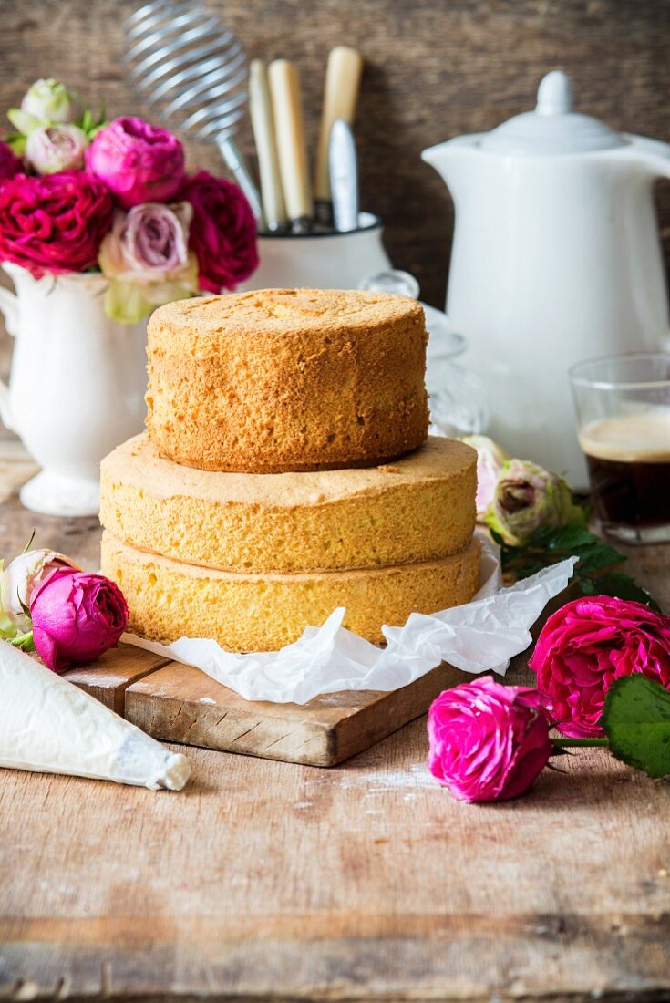 A two tier naked cake with a biscuit base