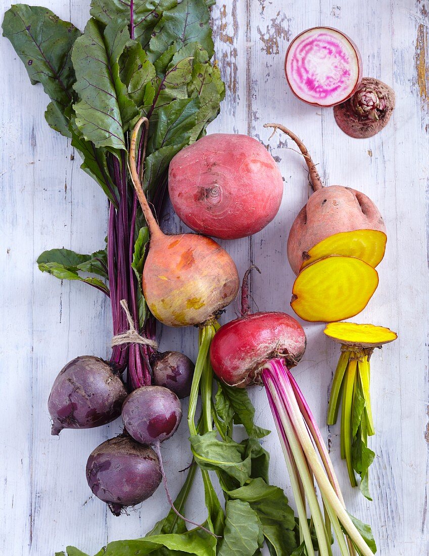 Colourful beets on a white wooden background