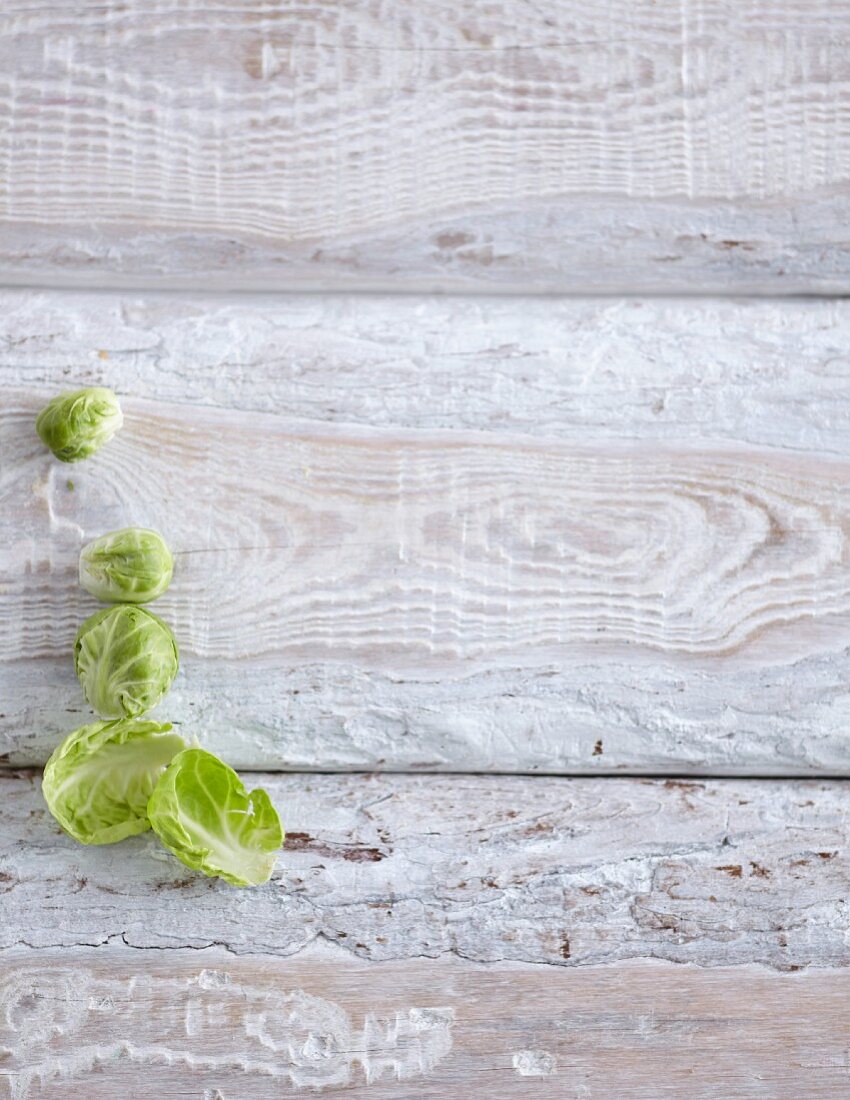 Brussels sprouts on a white wooden background