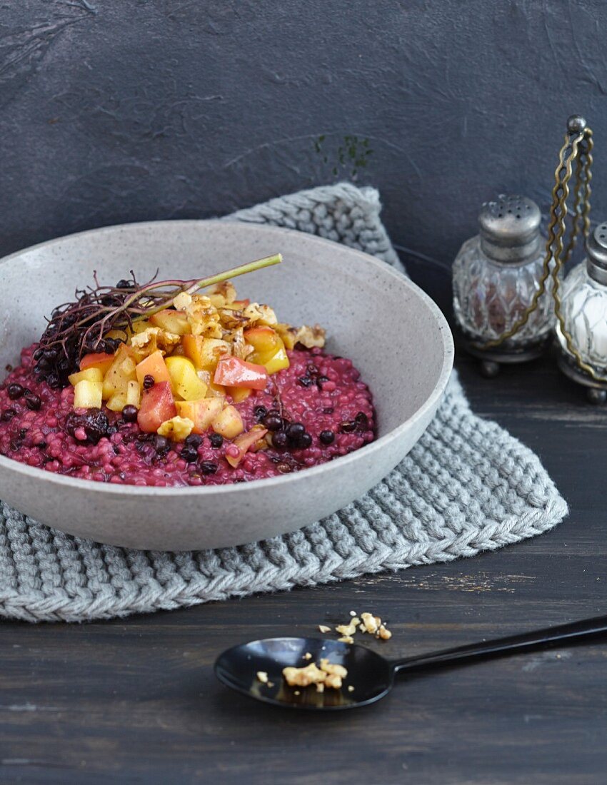 Elderberry and pearl barely risotto with baked apples