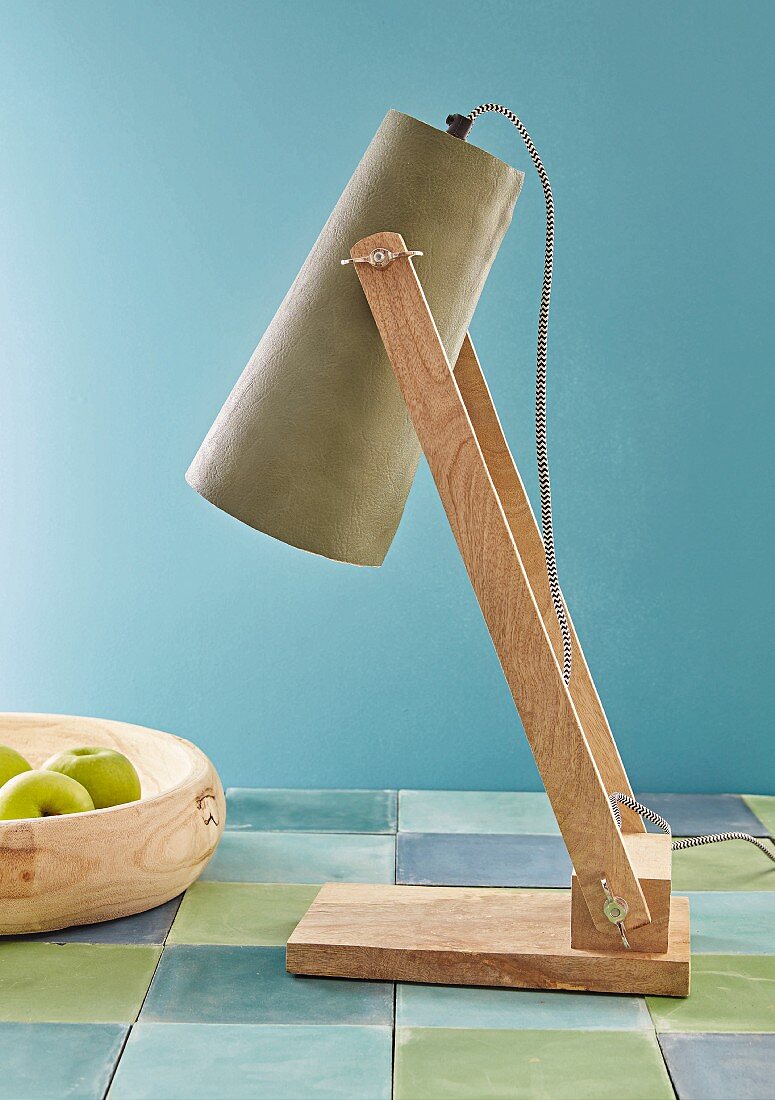 A lampshade covered in coloured faux leather