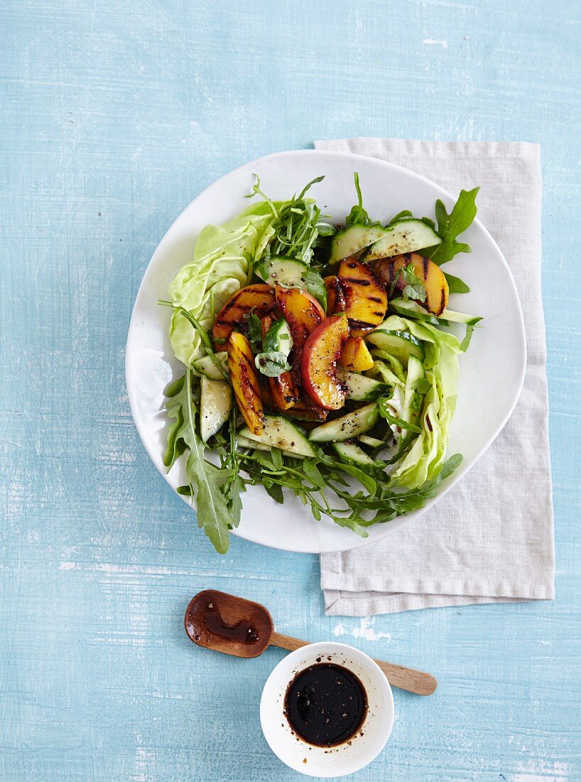 A salad with cucumber, rocket, and grilled peaches - 'Peach Tree'