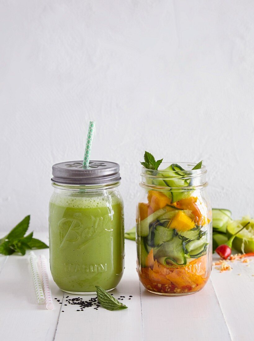 A green smoothie and a vegetable salad
