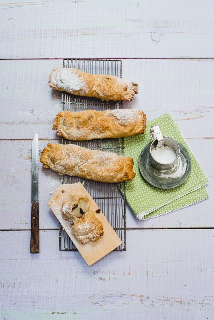 Small pear strudels with icing sugar