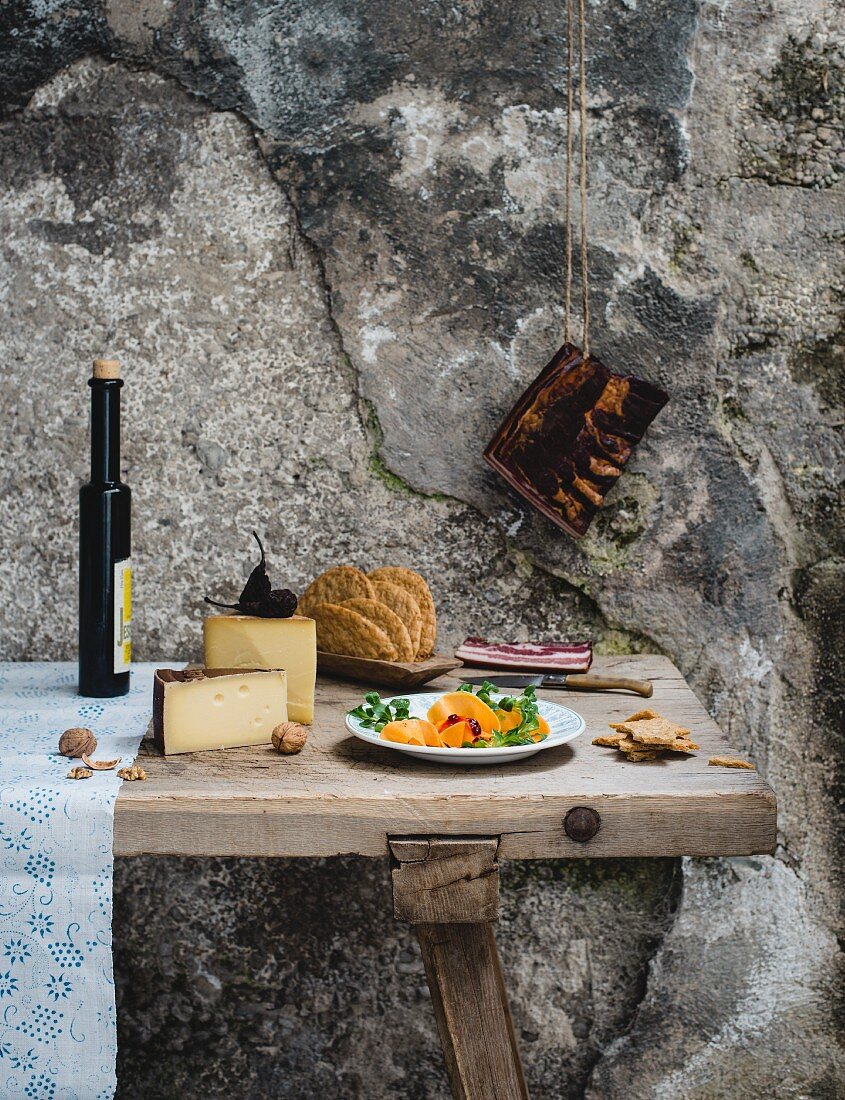 A rustic still life with ingredients for Alpine cuisine