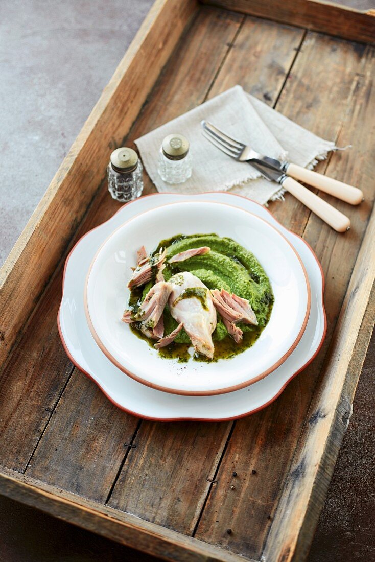 A pork loin with chervil oil and pea puree