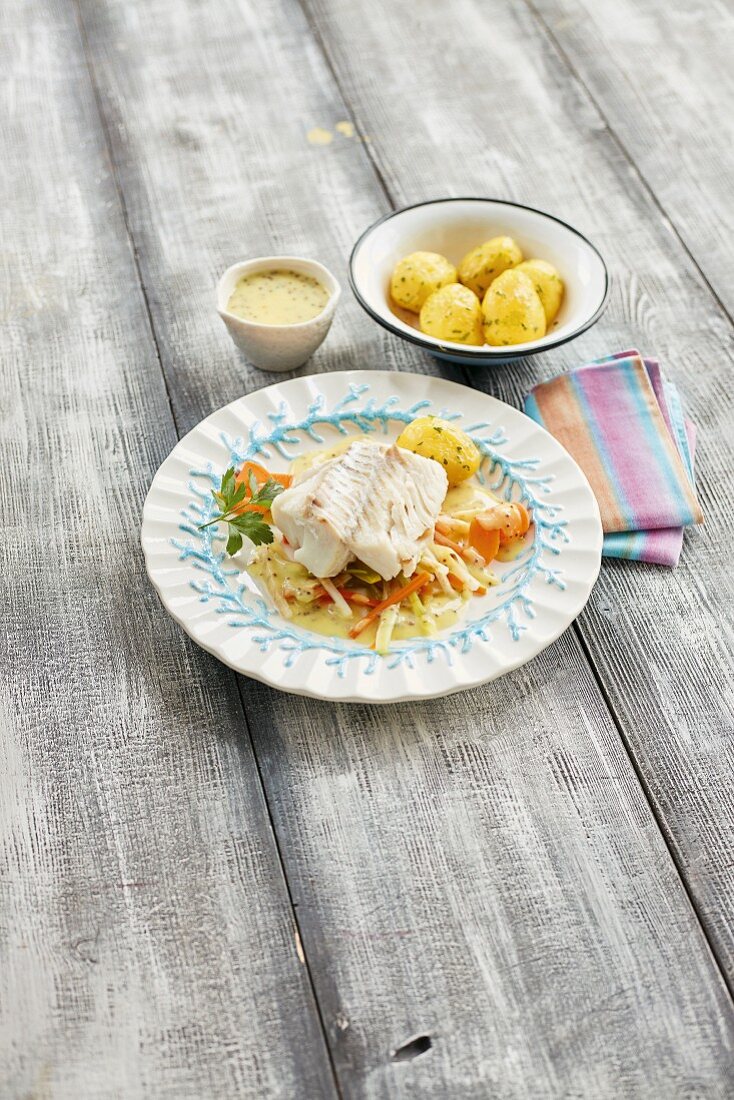 Cod cooked in vegetable stock with mustard sauce