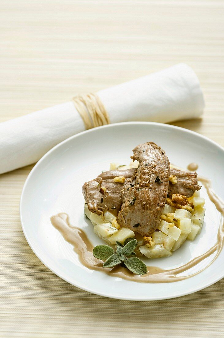 A lamb fillet fried in walnuts, with celery and sage ragout, and chestnut sauce