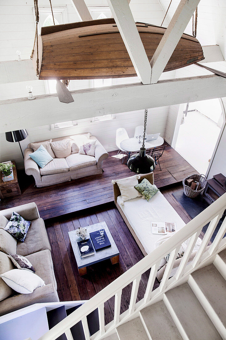 Top view of open living area with day bed and sofas in former church