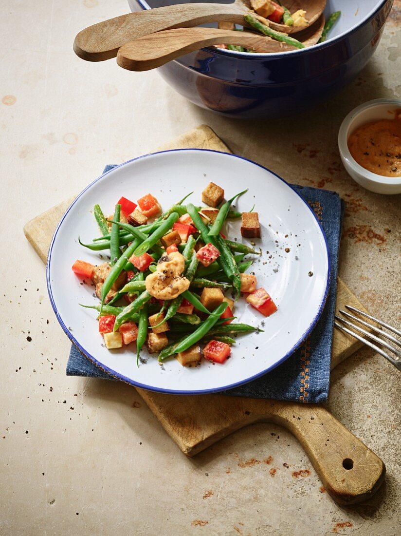 A green bean salad with sweet potatoes, smoked tofu and vegan mayo