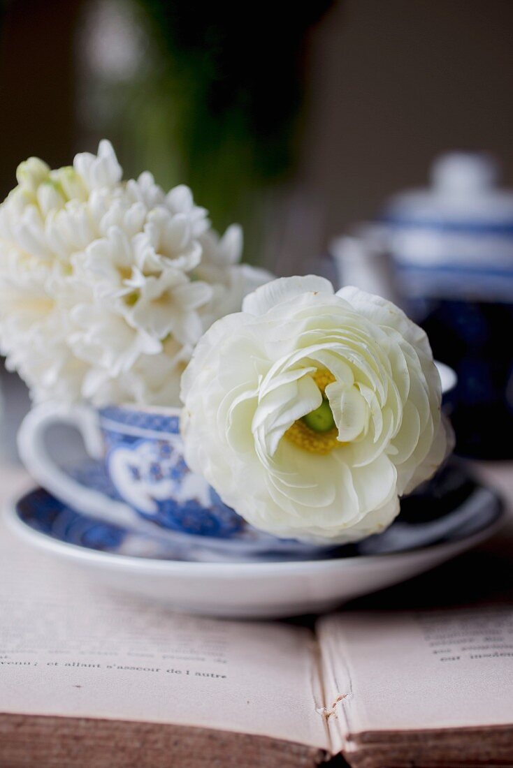 Breakfast tea on a book with flowers