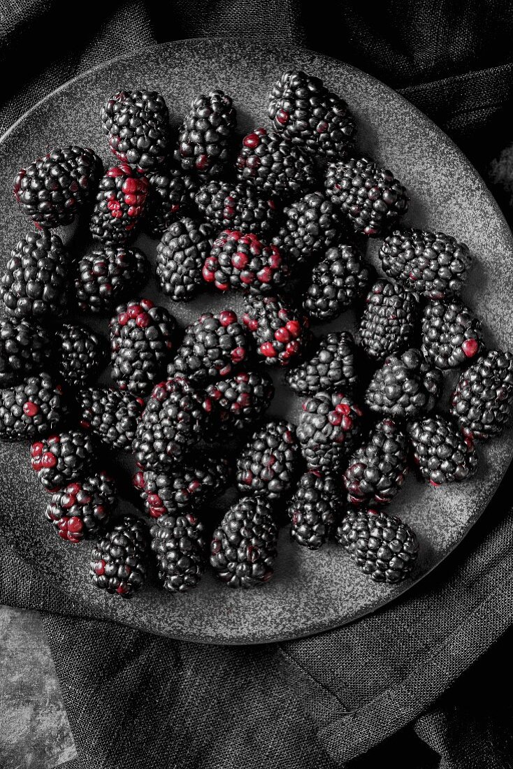 Blackberries on a dark plate