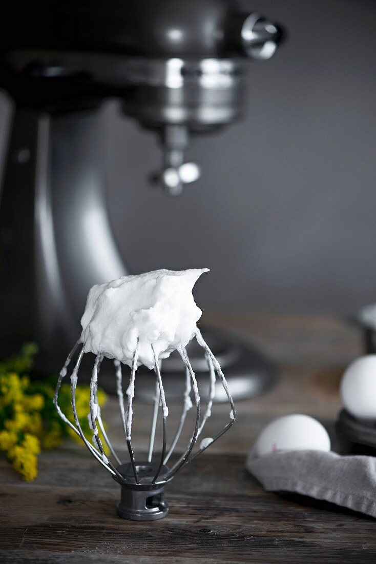 Whisked egg whites on a food processor whisk