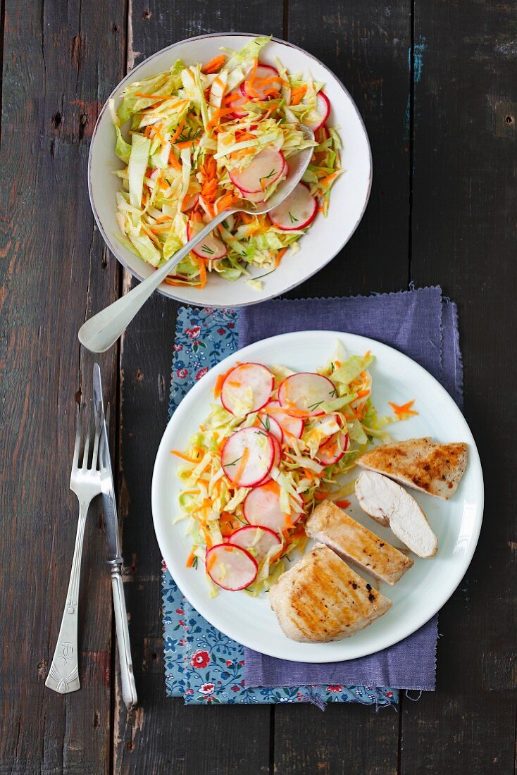 Grilled chicken breast with carrot and radish coleslaw
