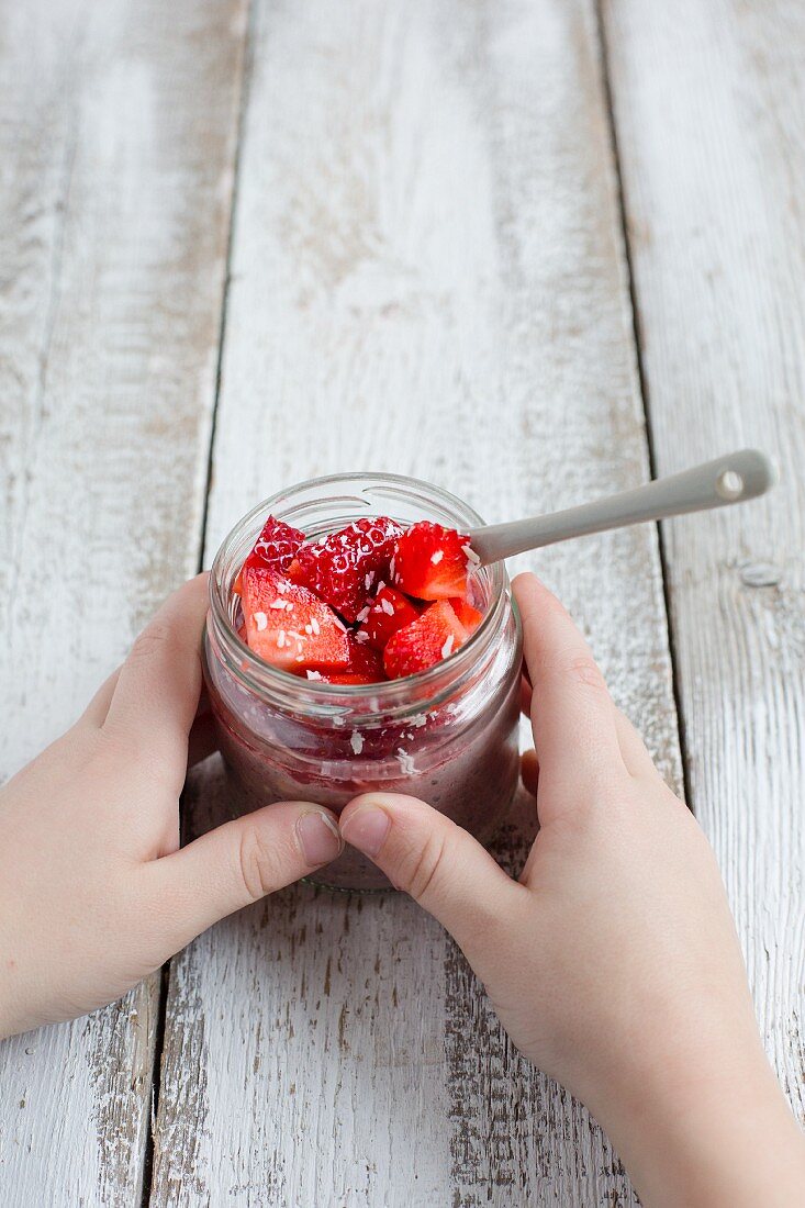 Overnight oats with strawberries in a glass jar