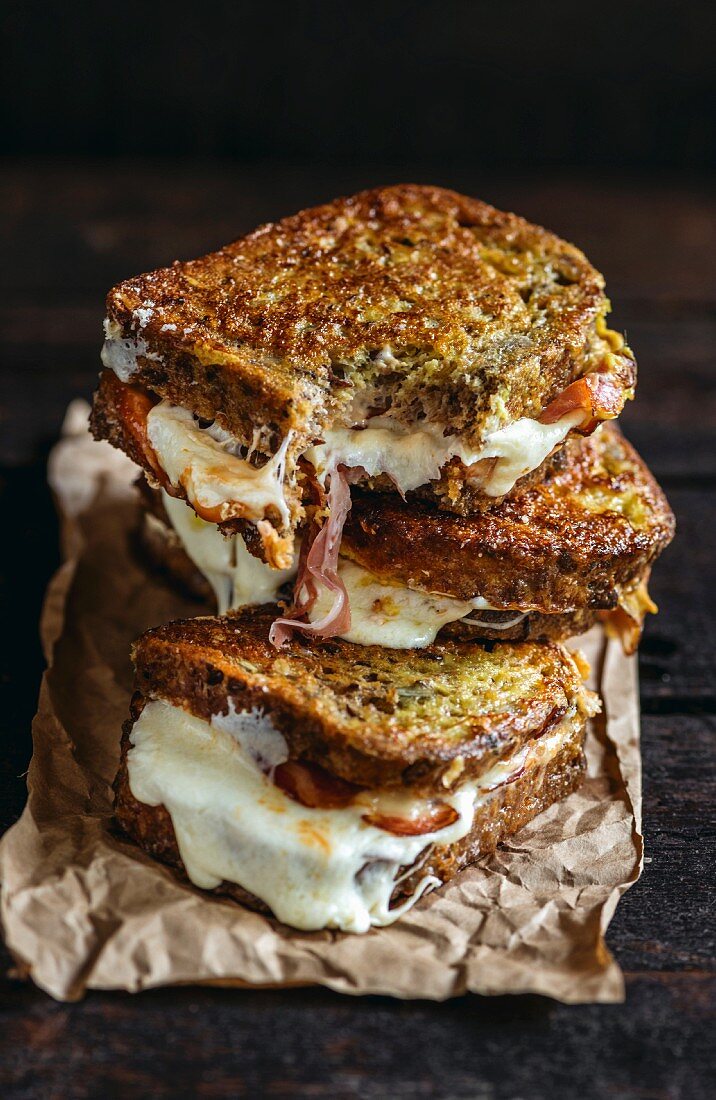 Melted mozzarella cheese and bacon in fried toast bread