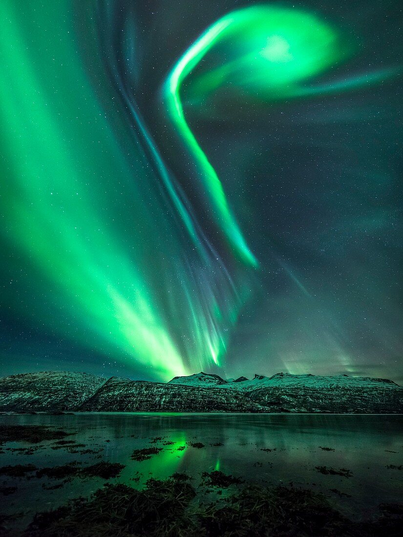 Aurora borealis over mountains