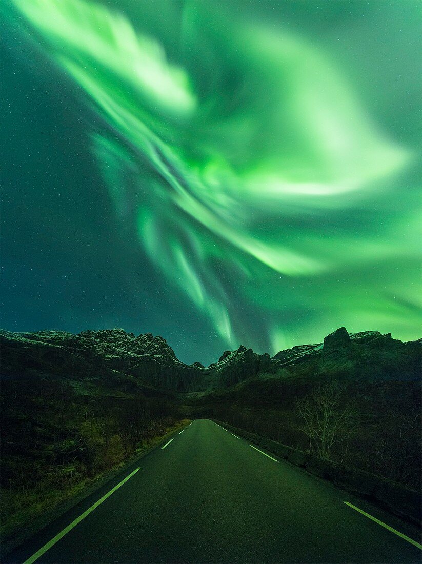 Aurora borealis over a road